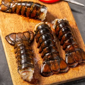 4 Maine Lobster Tails on wooden board